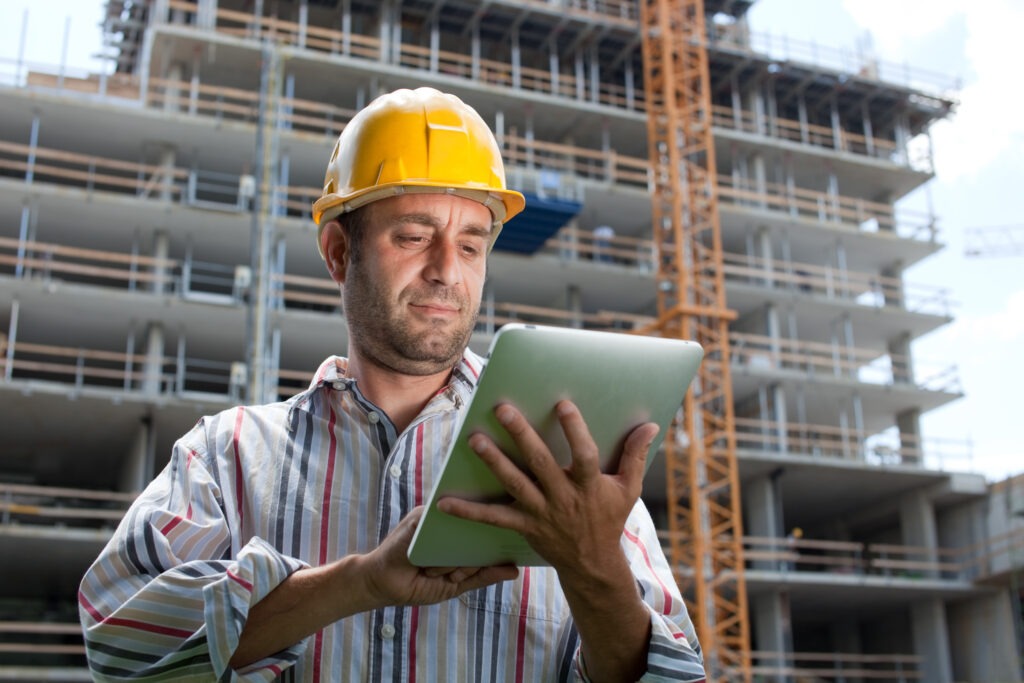 Construction specialist using a tablet computer.